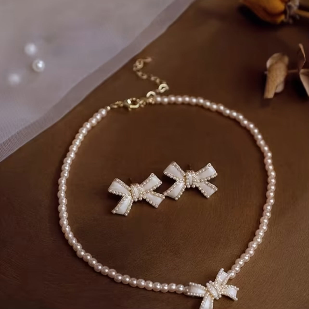 Elegant pearl necklace and earrings